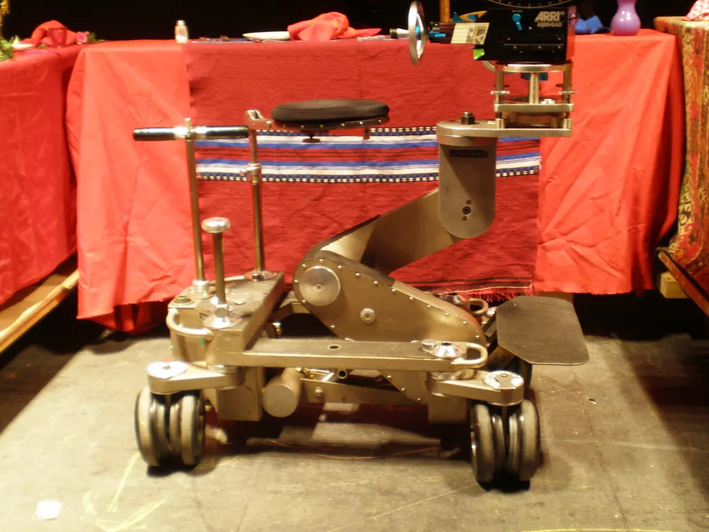 A Pee Wee II camera dolly on a film set, used to move the camera physically through a scene